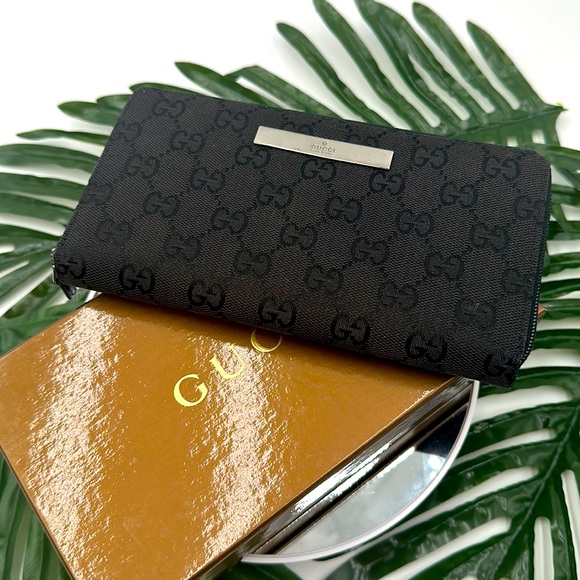 Gucci Handbags - Gucci Canvas long Zippy Wallet Like New with Box